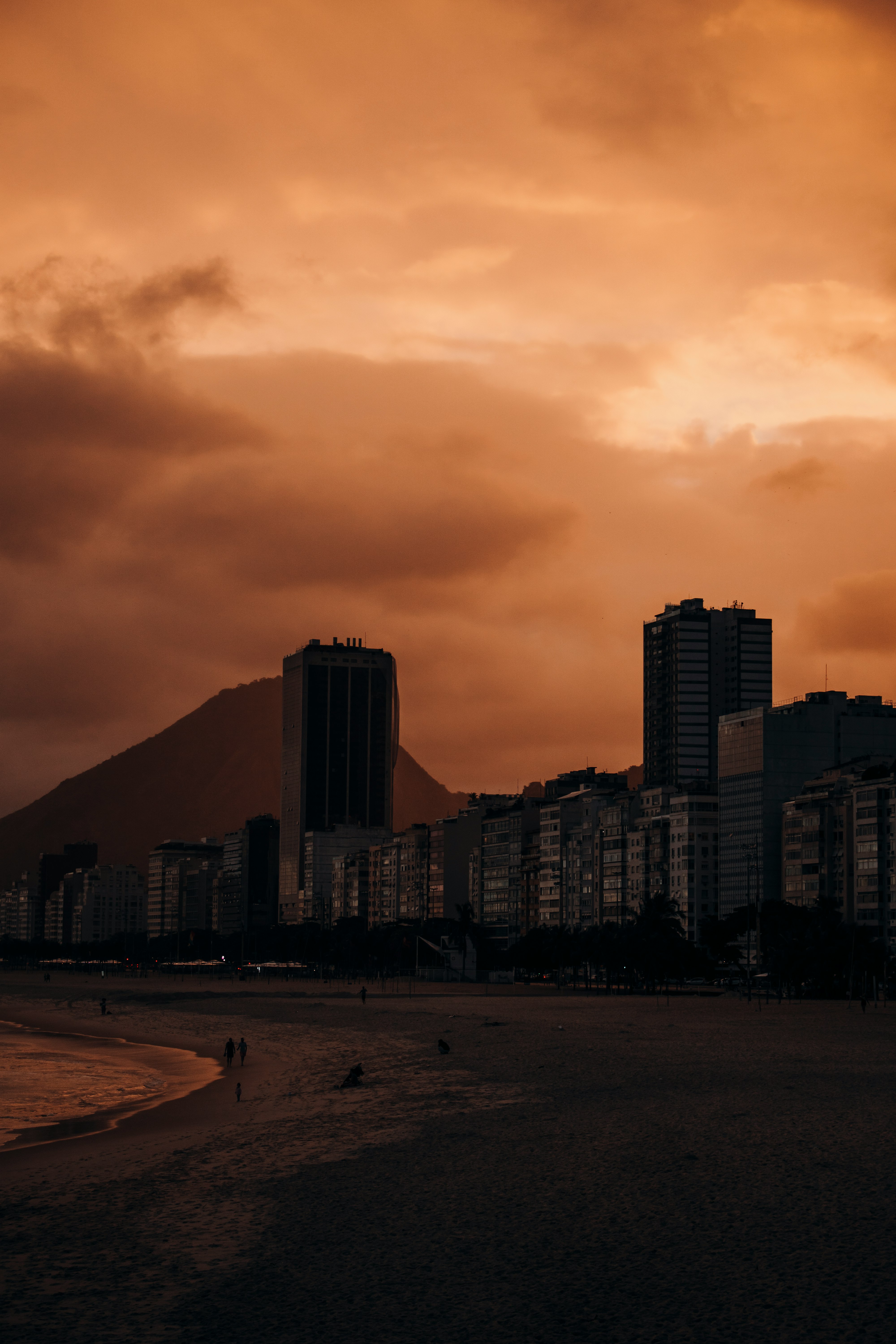 silhouette of city buildings during sunset